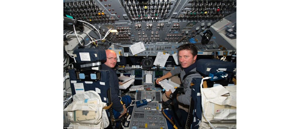 Commander Mark Kelly and Italian astronaut Roberto Vittori sit on Endeavour's flight deck during what was the Nasa vessel's final mission (c) NASA
